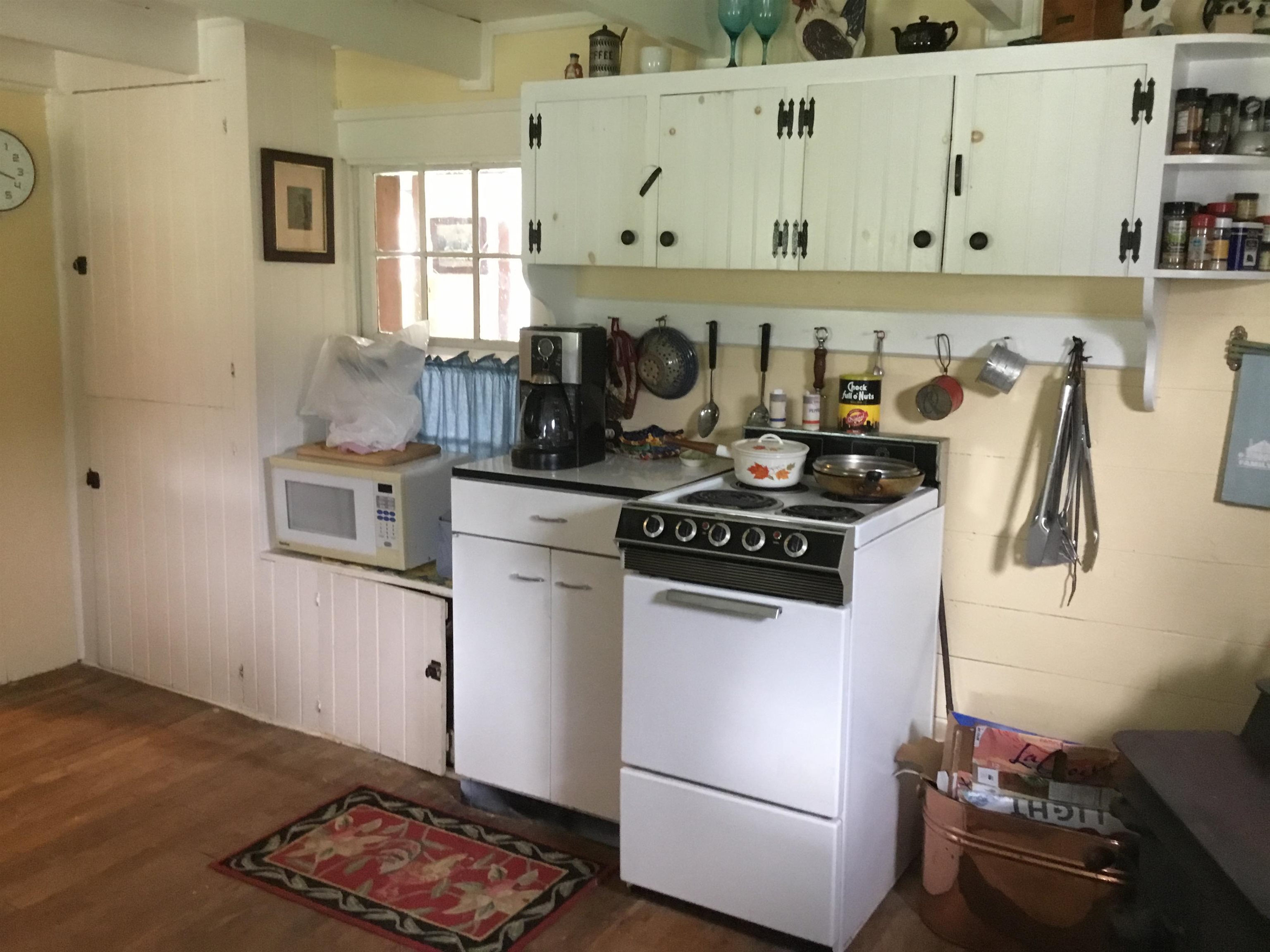 407 J Mallow Road Franklin, WV 26807 - Photo 20 of 39 a kitchen with a stove and a refrigerator