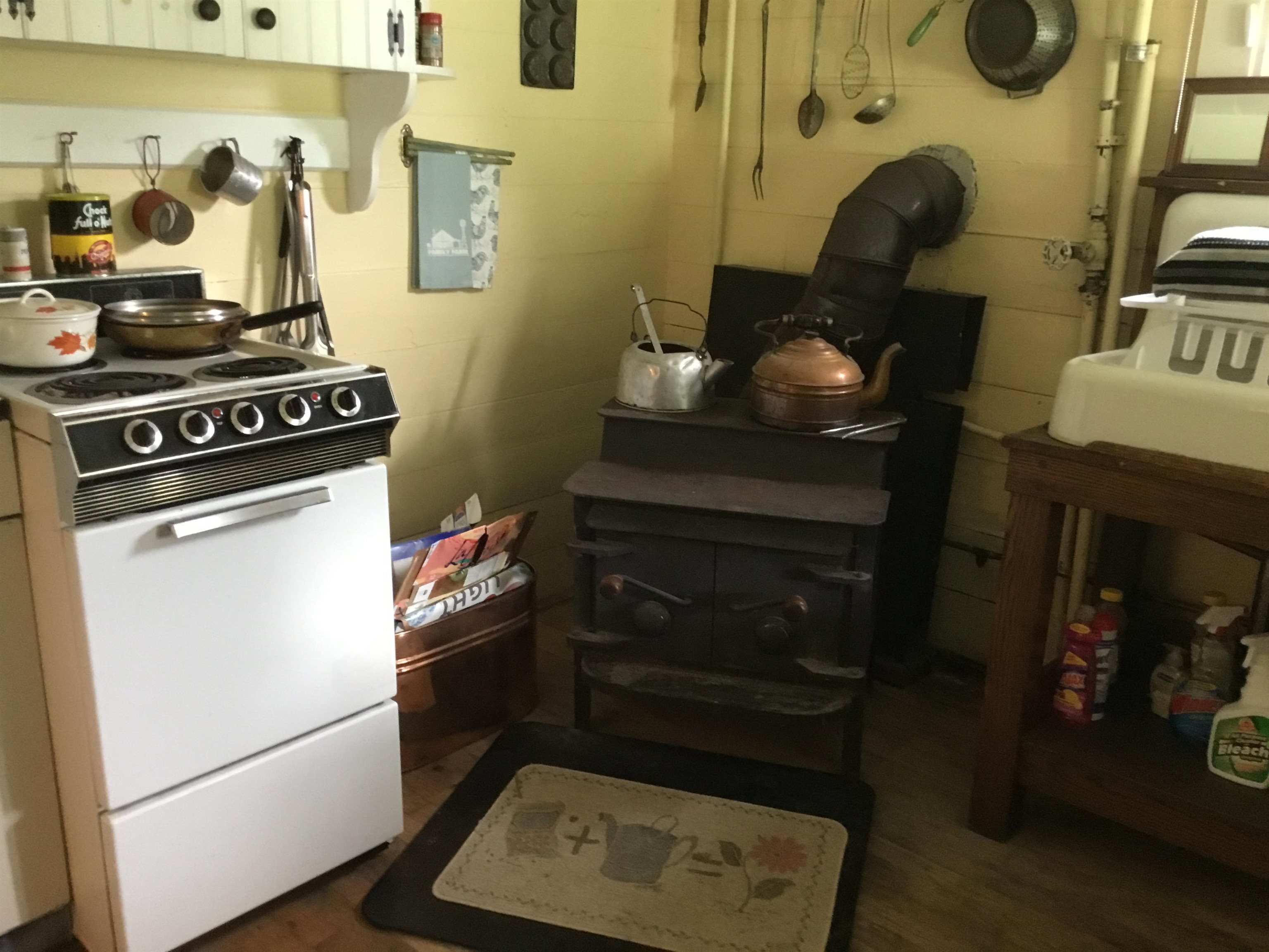 407 J Mallow Road Franklin, WV 26807 - Photo 21 of 39 a kitchen with a stove and a wooden floor
