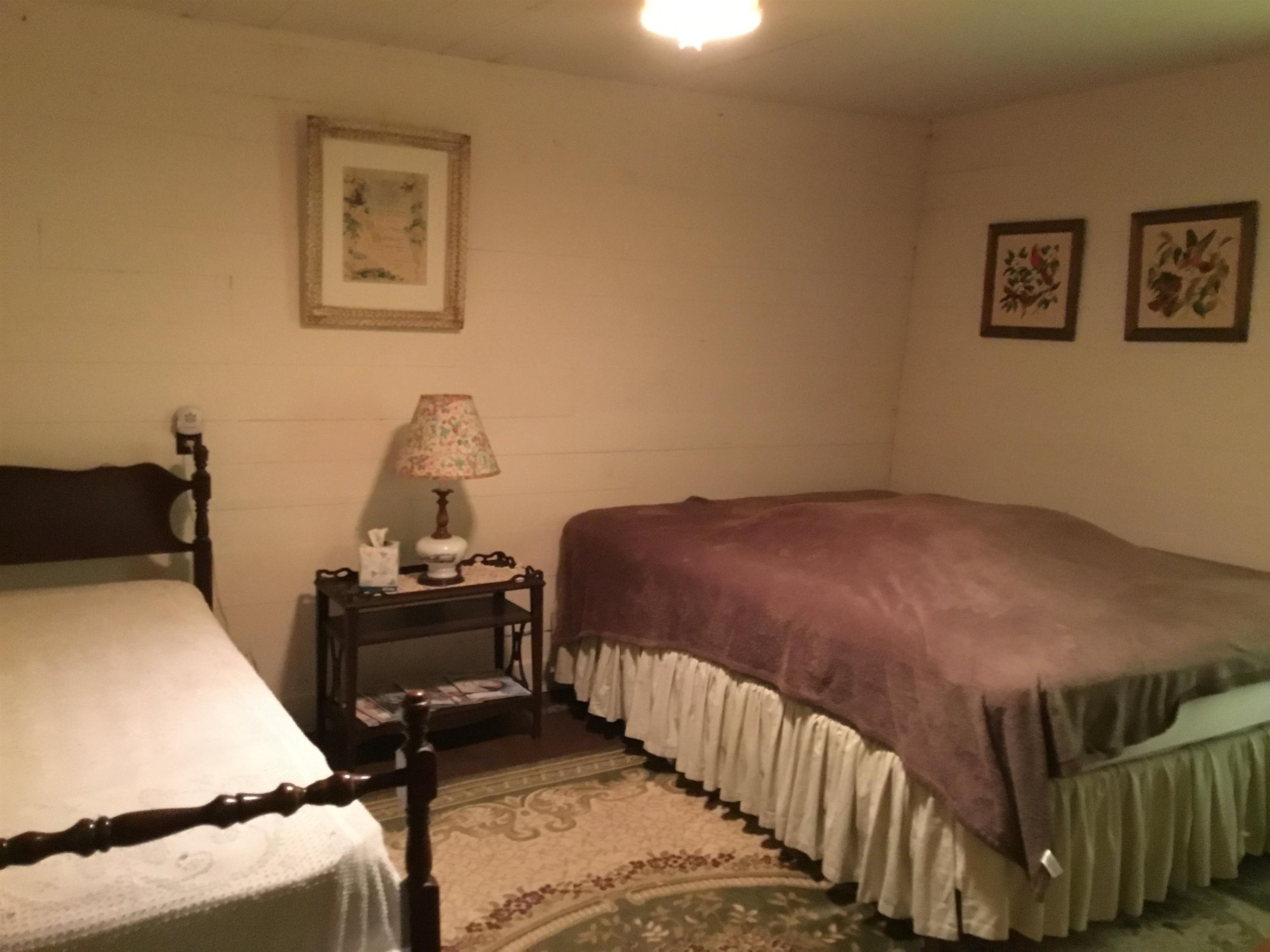 407 J Mallow Road Franklin, WV 26807 - Photo 25 of 39 a bedroom with a bed and wooden floor