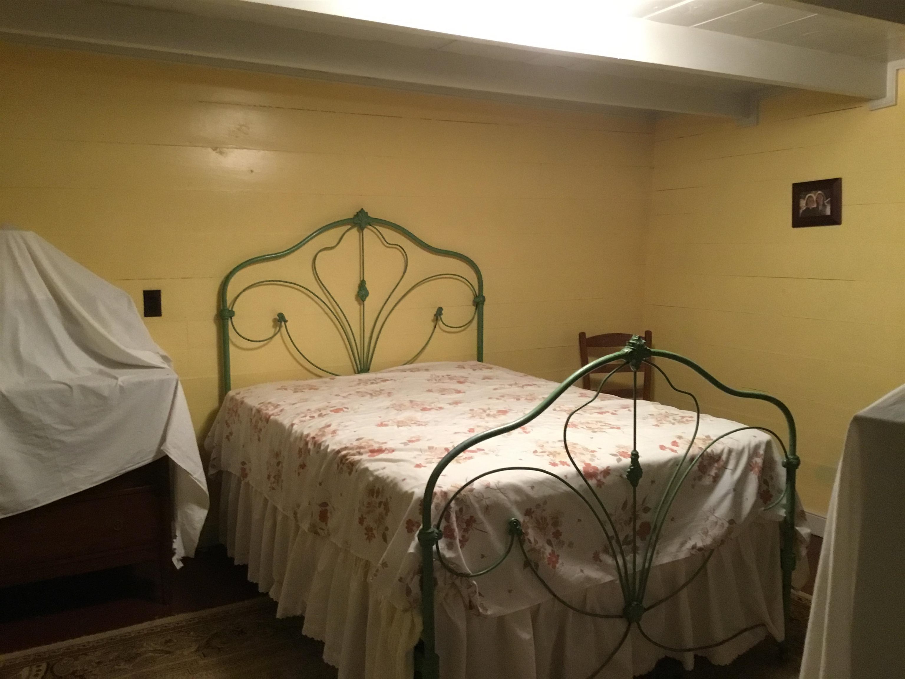 407 J Mallow Road Franklin, WV 26807 - Photo 36 of 39 a bedroom with a bed and a painting on the wall
