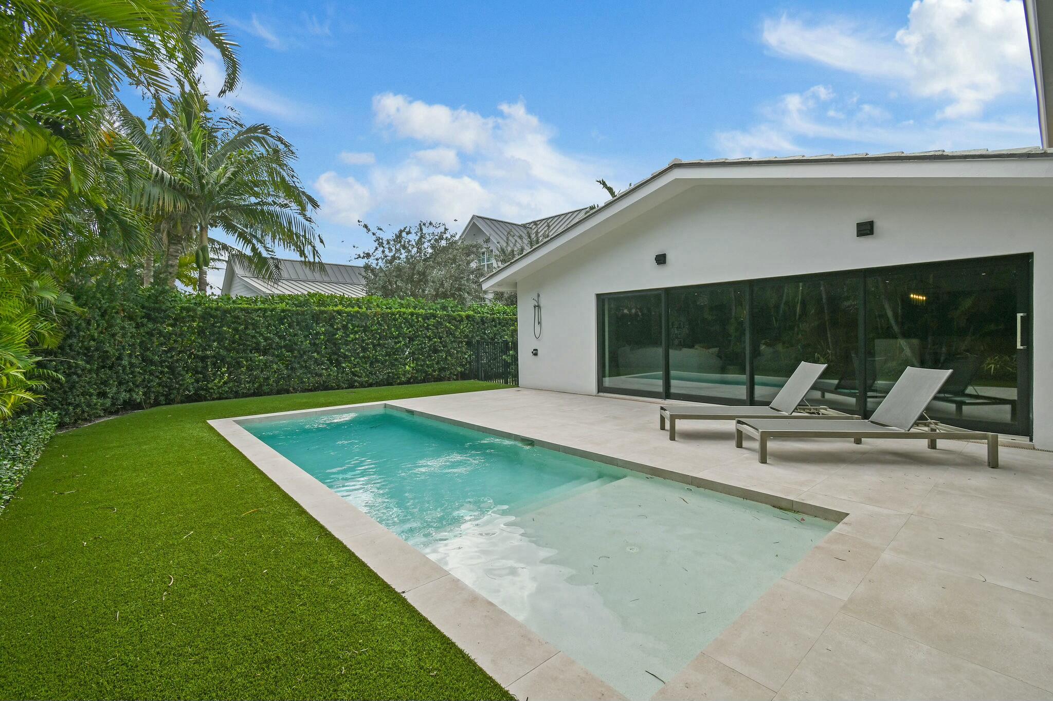 170 Beacon Lane Jupiter Inlet Colony, FL 33469 - Photo 28 of 46 a view of a backyard with sitting area