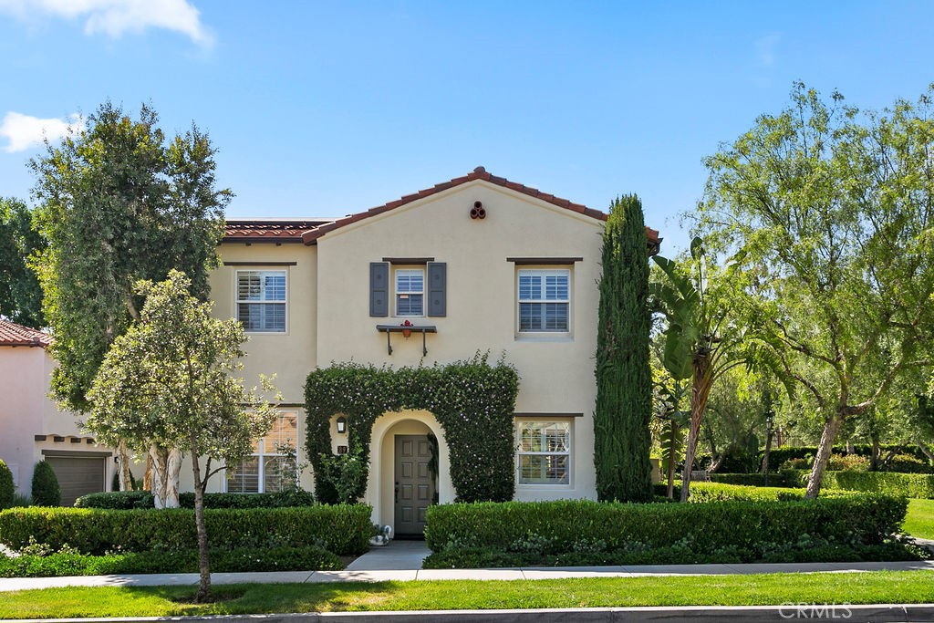 89 Talmadge, Unit 64 Irvine, CA 92602 - Photo 1 of 1 a front view of a house with a yard