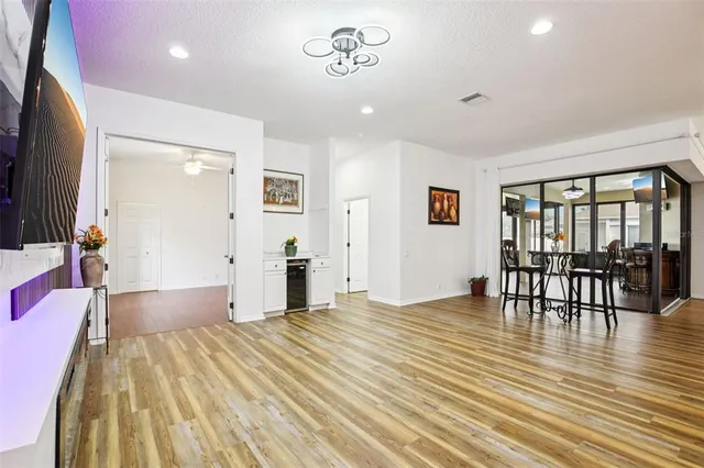 a spacious bedroom with a bed and a table