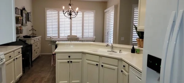 a kitchen with a sink stove and cabinets