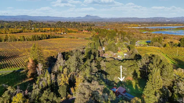an aerial view of house with yard swimming pool and outdoor seating