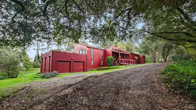 a view of front door with a door and wooden floor