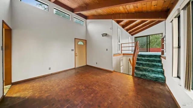 a view of an empty room with a windows