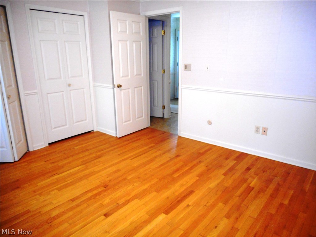 8800 Sherman Road Chesterland, OH 44026 - Photo 6 of 20 First floor Master Bedroom has a private bath and whirlpool tub. Lots of storage here with three closets and more hardwood flooring!