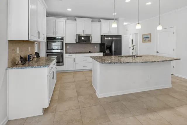 a view of kitchen with cabinets and outdoor seating