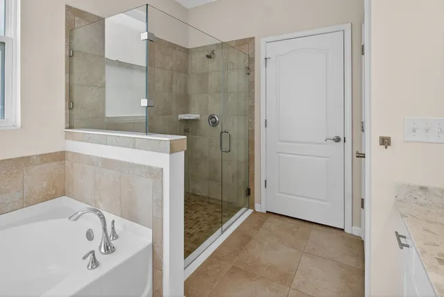 a bedroom with a bed and a walk in closet