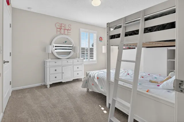 a bathroom with a double vanity sink toilet and shower