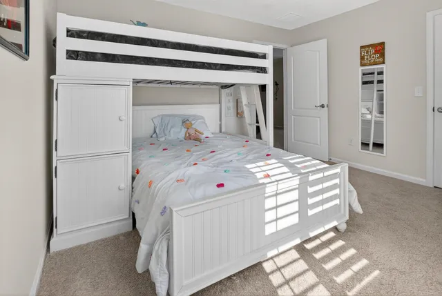 a bathroom with a sink a vanity and a shower curtain