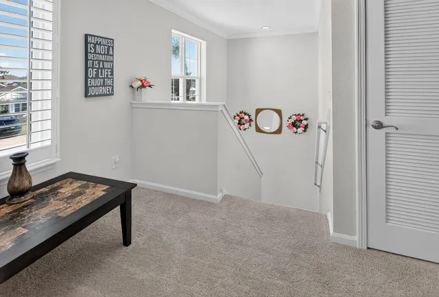 a bed sitting in a bedroom next to a dresser