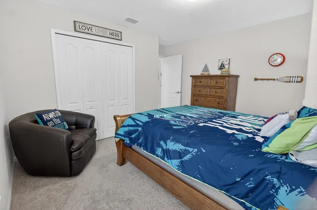 a room with gym equipment and large mirror