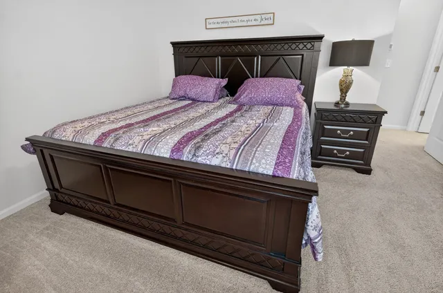 a swimming pool with outdoor seating and yard