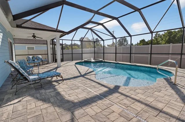 an aerial view of residential building with parking