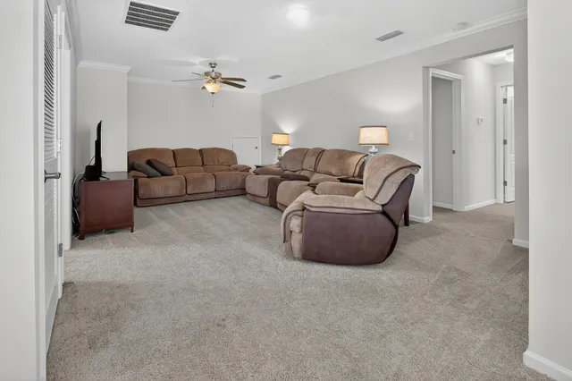 a spacious bedroom with a bed and large window