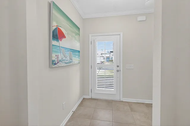 a large white kitchen with lots of counter space and a sink
