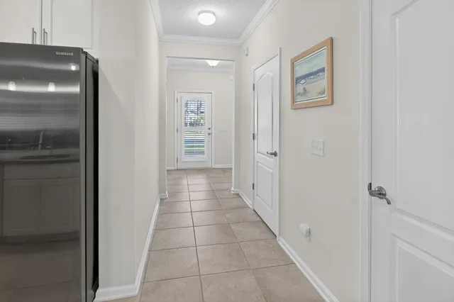 a kitchen with stainless steel appliances granite countertop a sink a stove a refrigerator and a oven