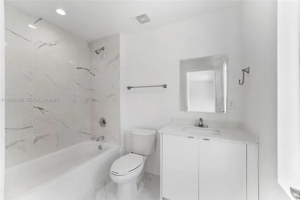 a bathroom with a sink toilet a shower and bathtub