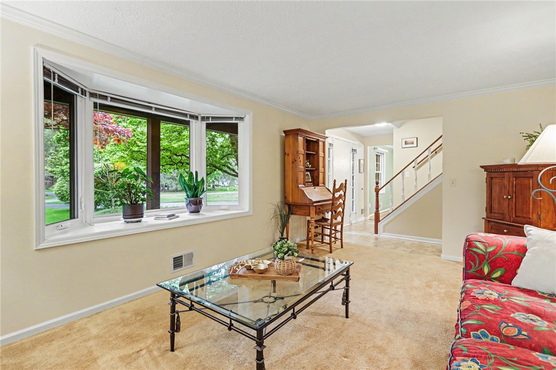 10 High Point Drive Parma, NY 14559 - Photo 3 of 28 Living room features a large bay window.