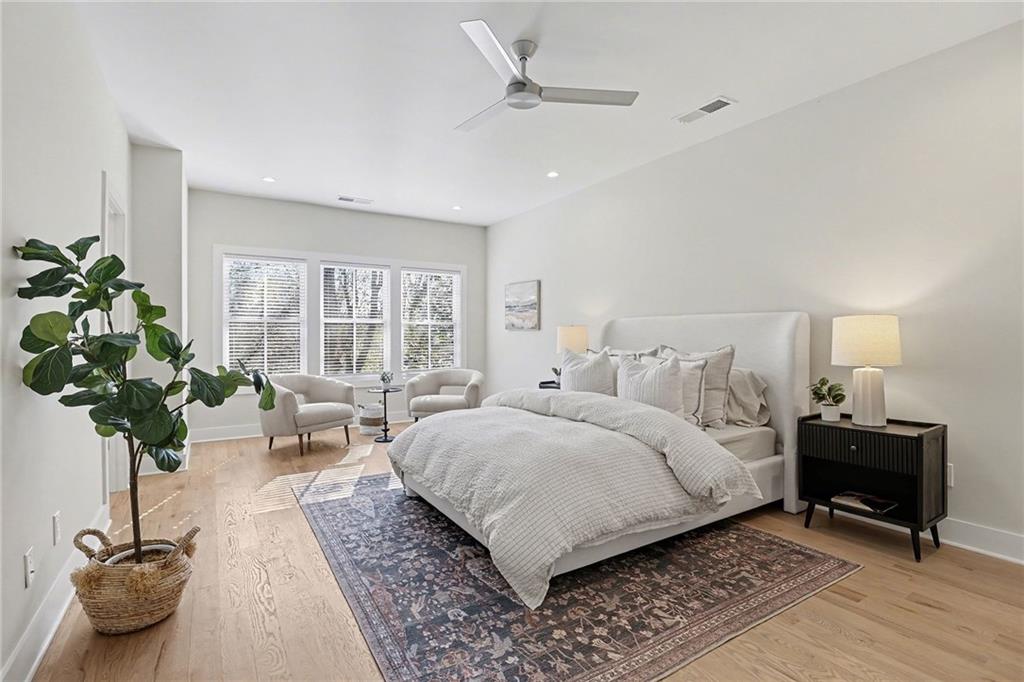 2149 Druid Flds Lane Decatur, GA 30033 - Photo 11 of 25 a bedroom with a bed a couch and potted plant