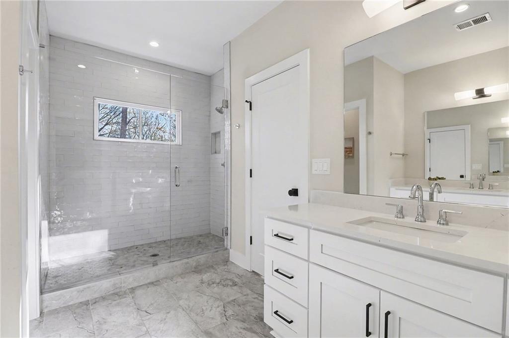 2149 Druid Flds Lane Decatur, GA 30033 - Photo 14 of 25 a bathroom with a shower sink and mirror