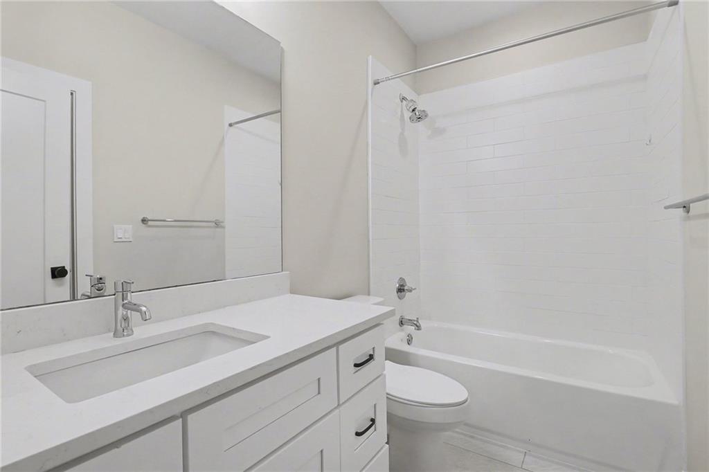 2149 Druid Flds Lane Decatur, GA 30033 - Photo 19 of 25 a bathroom with a sink a toilet and shower