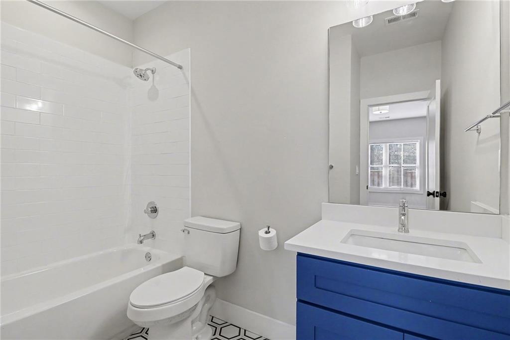 2149 Druid Flds Lane Decatur, GA 30033 - Photo 20 of 25 a bathroom with a sink toilet vanity and shower