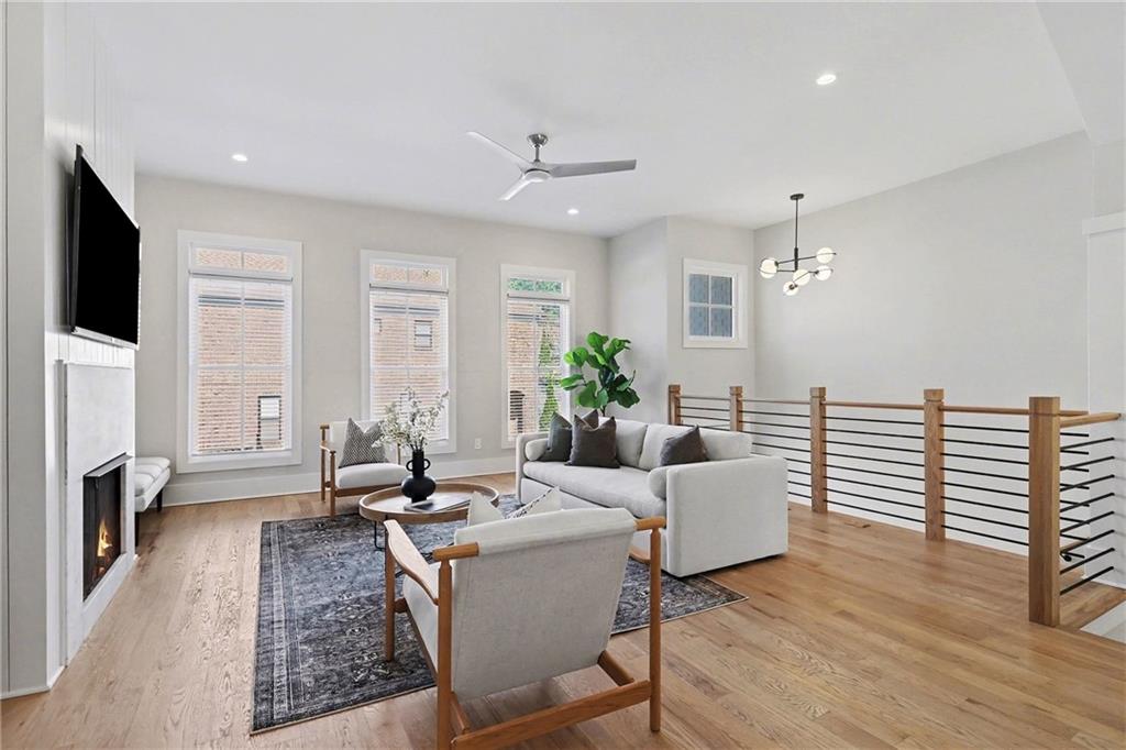 2149 Druid Flds Lane Decatur, GA 30033 - Photo 3 of 25 a living room with furniture and a flat screen tv