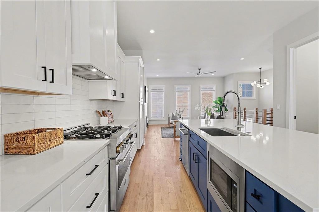 2149 Druid Flds Lane Decatur, GA 30033 - Photo 7 of 25 a kitchen with stainless steel appliances a sink stove and cabinets