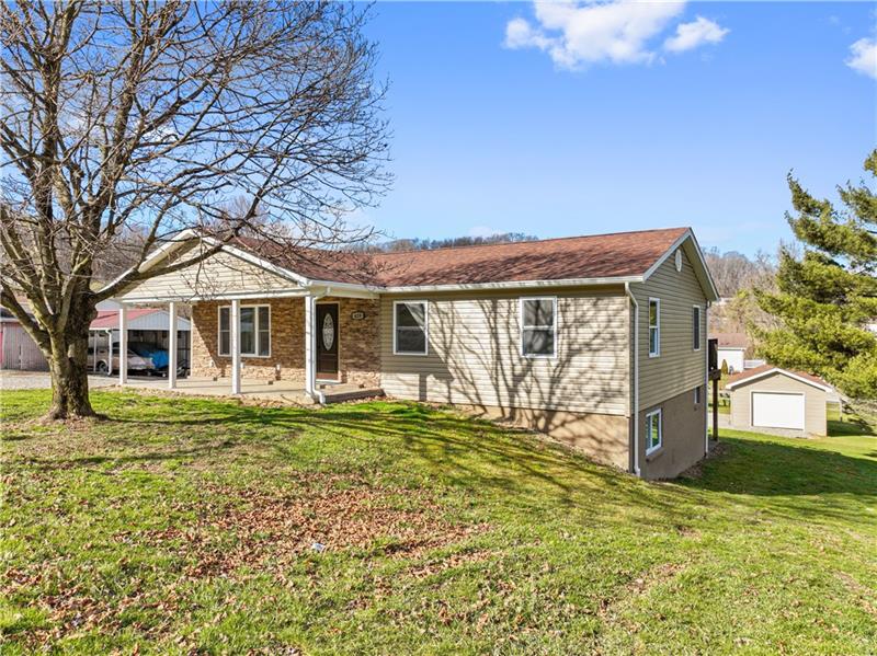 629 Upper Middletown Road Smock, PA 15480 - Photo 1 of 46 a front view of a house with a yard