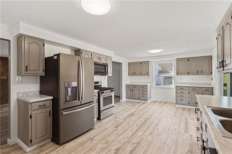 629 Upper Middletown Road Smock, PA 15480 - Photo 21 of 46 a kitchen with stainless steel appliances a refrigerator and a stove top oven