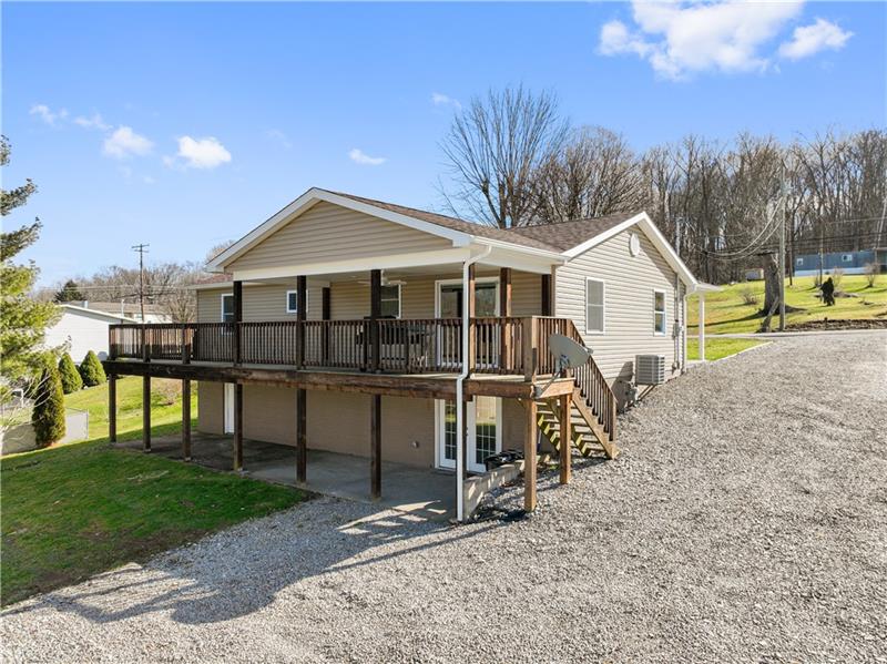 629 Upper Middletown Road Smock, PA 15480 - Photo 4 of 46 a view of a house with a yard
