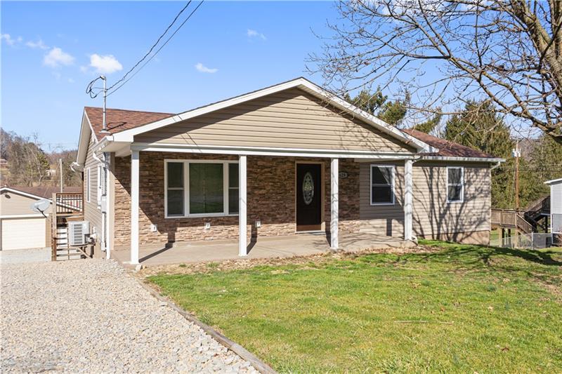 629 Upper Middletown Road Smock, PA 15480 - Photo 46 of 46 a house with yard in front of it
