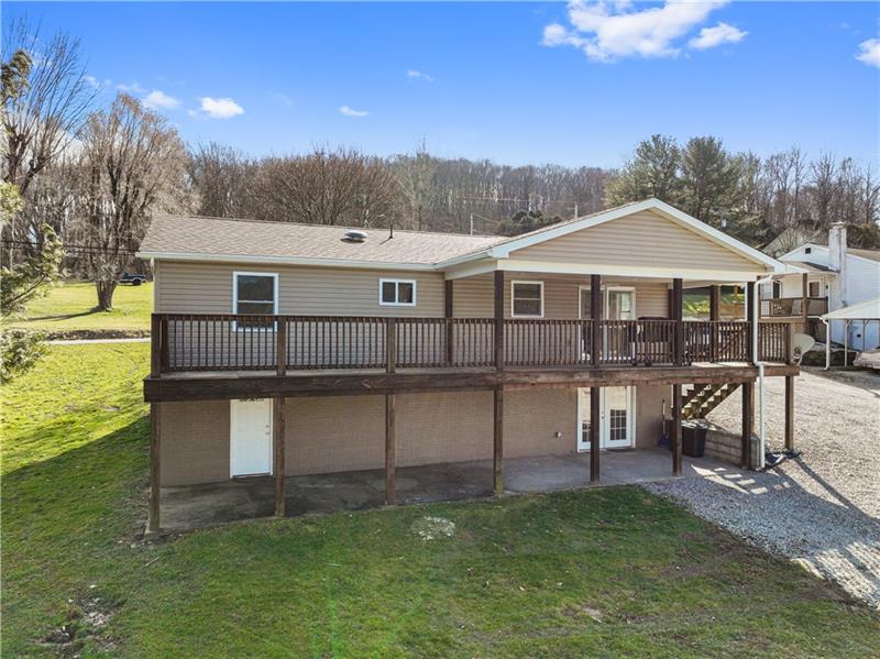 629 Upper Middletown Road Smock, PA 15480 - Photo 5 of 46 a view of a house with a yard balcony and a garden