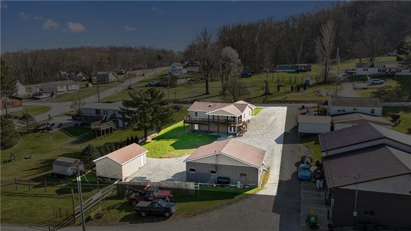629 Upper Middletown Road Smock, PA 15480 - Photo 10 of 46 an aerial view of a house with garden space and street view