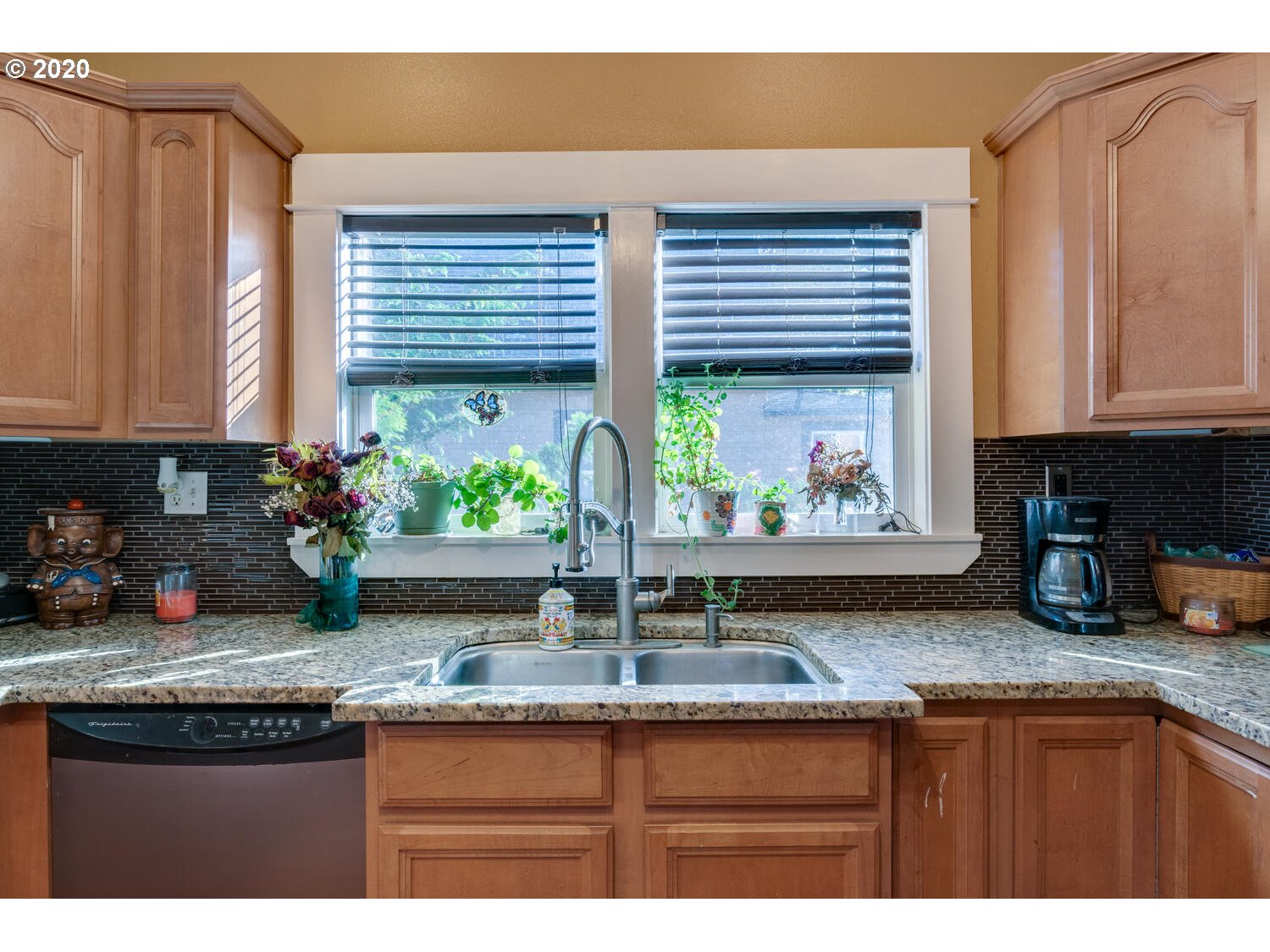 409 North 1st Avenue Ridgefield, WA 98642 - Photo 8 of 24 a kitchen with granite countertop a sink and a window