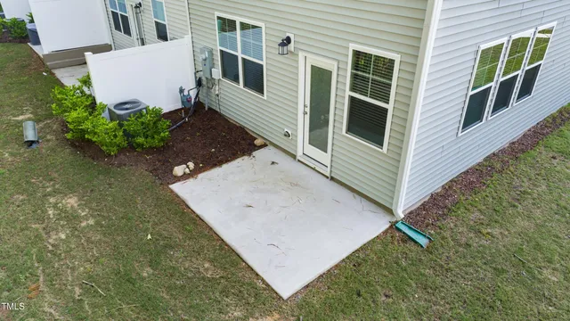 an aerial view of a house with a yard and garage