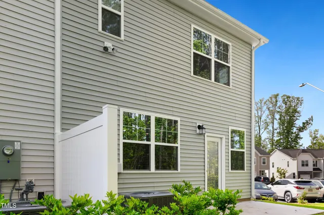 a view of a windows and yard in the back