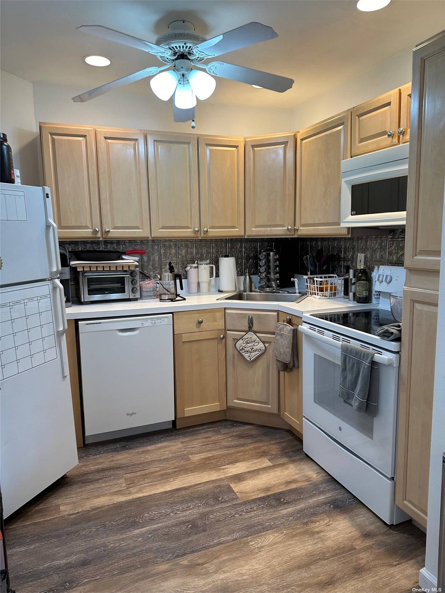 a kitchen with a sink cabinets and appliances