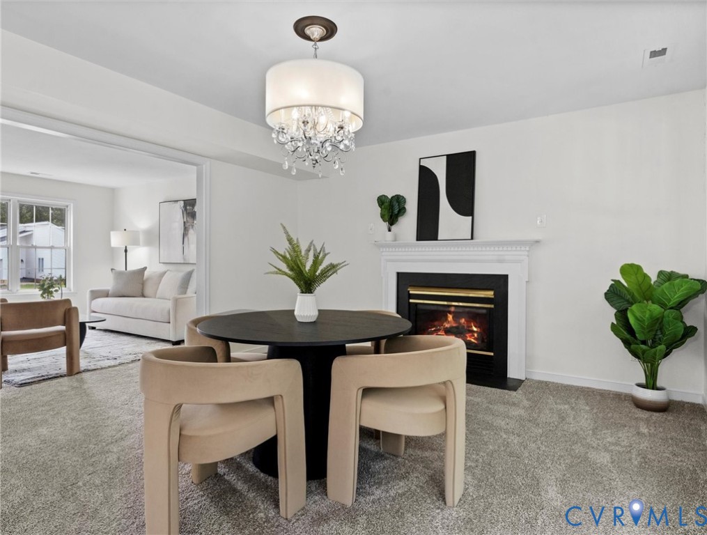 7416 Willow Ridge Terrace Glen Allen, VA 23060 - Photo 14 of 48 a view of a dining room with furniture and chandelier