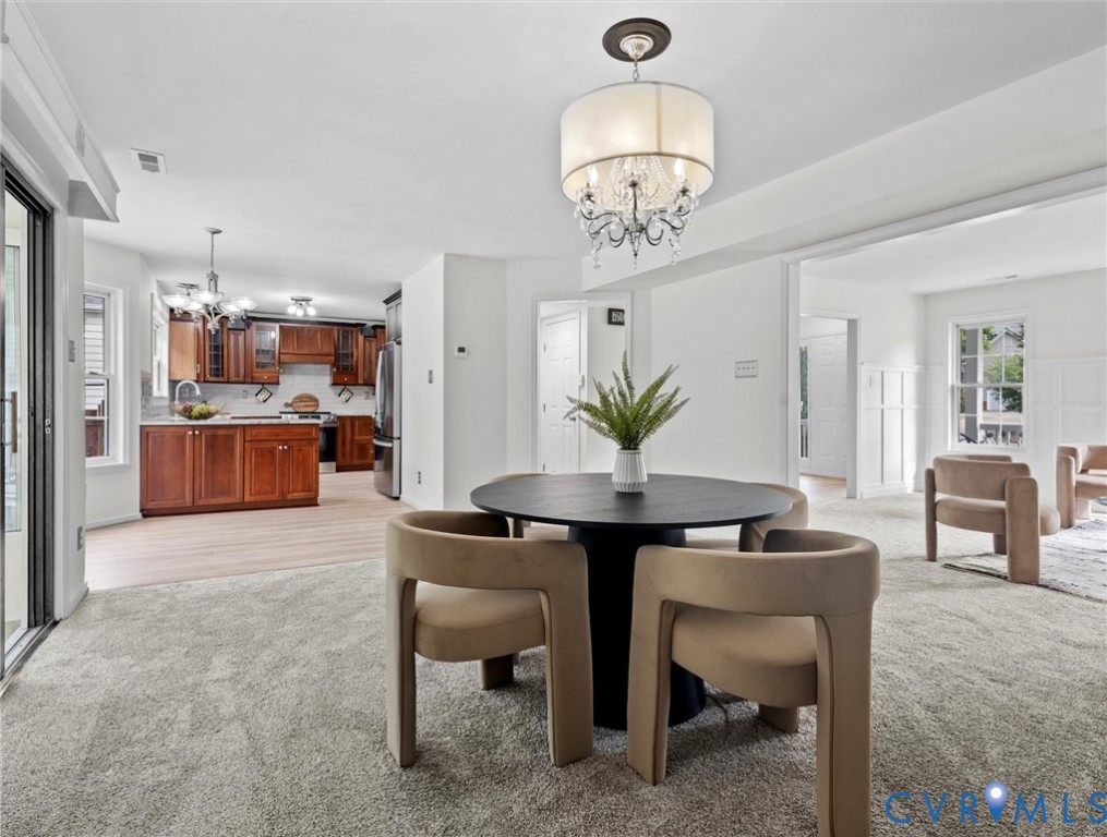 7416 Willow Ridge Terrace Glen Allen, VA 23060 - Photo 16 of 48 a view of a dining room with furniture and chandelier