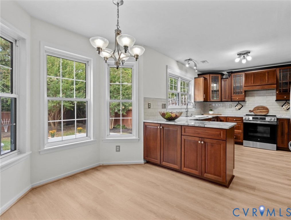 7416 Willow Ridge Terrace Glen Allen, VA 23060 - Photo 18 of 48 a kitchen with granite countertop wooden floors granite counter tops and a window