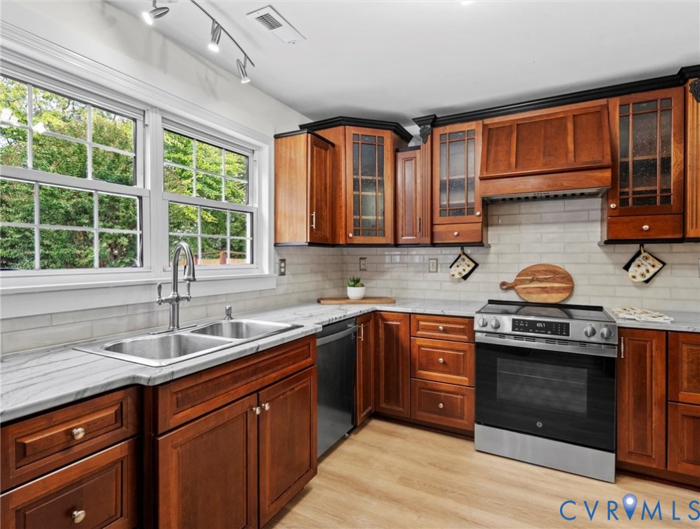 7416 Willow Ridge Terrace Glen Allen, VA 23060 - Photo 21 of 48 a kitchen with stainless steel appliances granite countertop a sink stove and cabinets