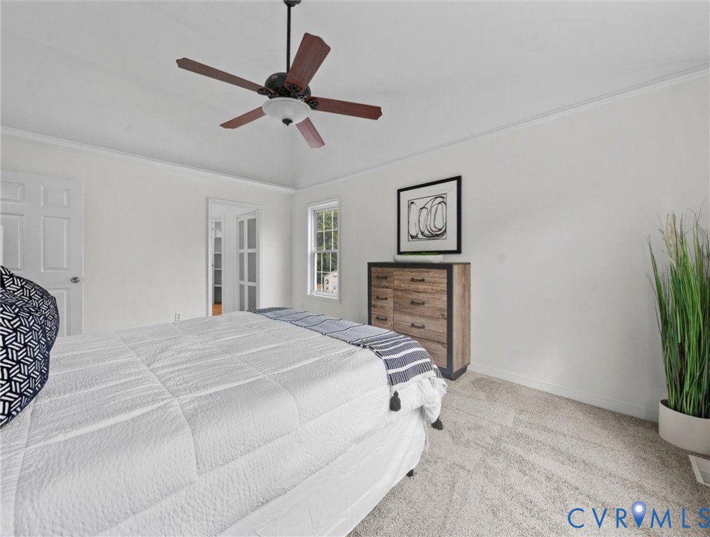 7416 Willow Ridge Terrace Glen Allen, VA 23060 - Photo 29 of 48 a spacious bedroom with a bed and a potted plant