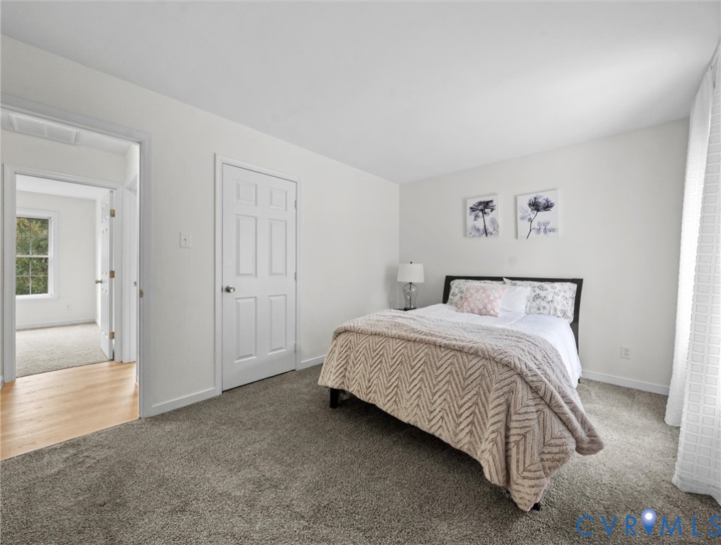 7416 Willow Ridge Terrace Glen Allen, VA 23060 - Photo 35 of 48 a bedroom with a bed and a view of bathroom