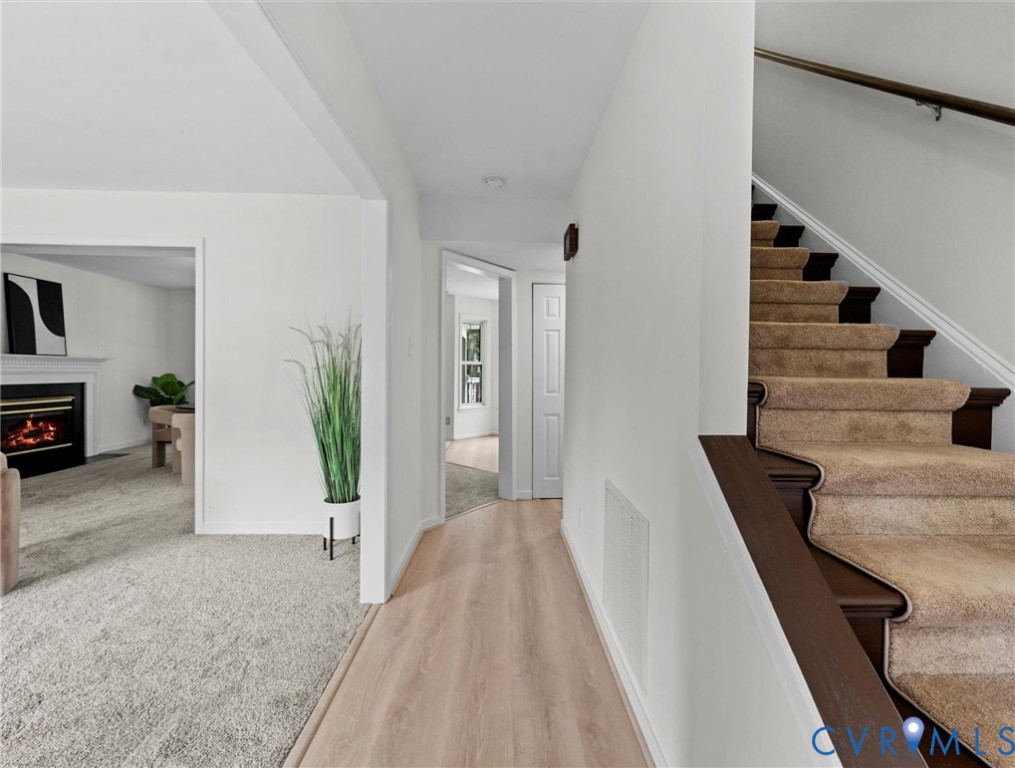 7416 Willow Ridge Terrace Glen Allen, VA 23060 - Photo 7 of 48 a view of a hallway with furniture and stairs
