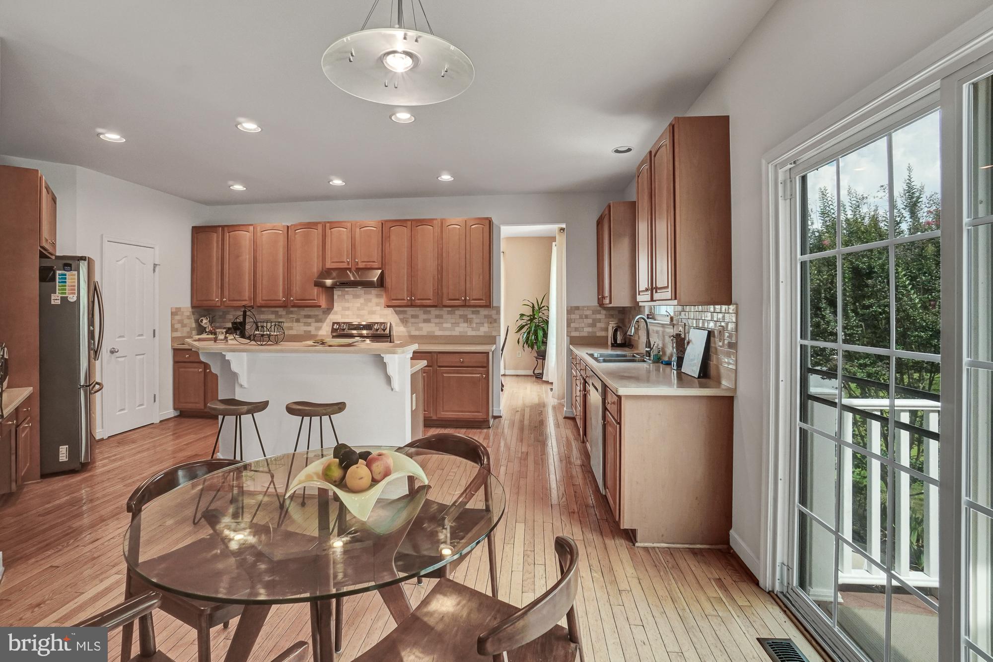 8059 High Castle Road Ellicott City, MD 21043 - Photo 15 of 45 Kitchen with new SS appliances & door to deck