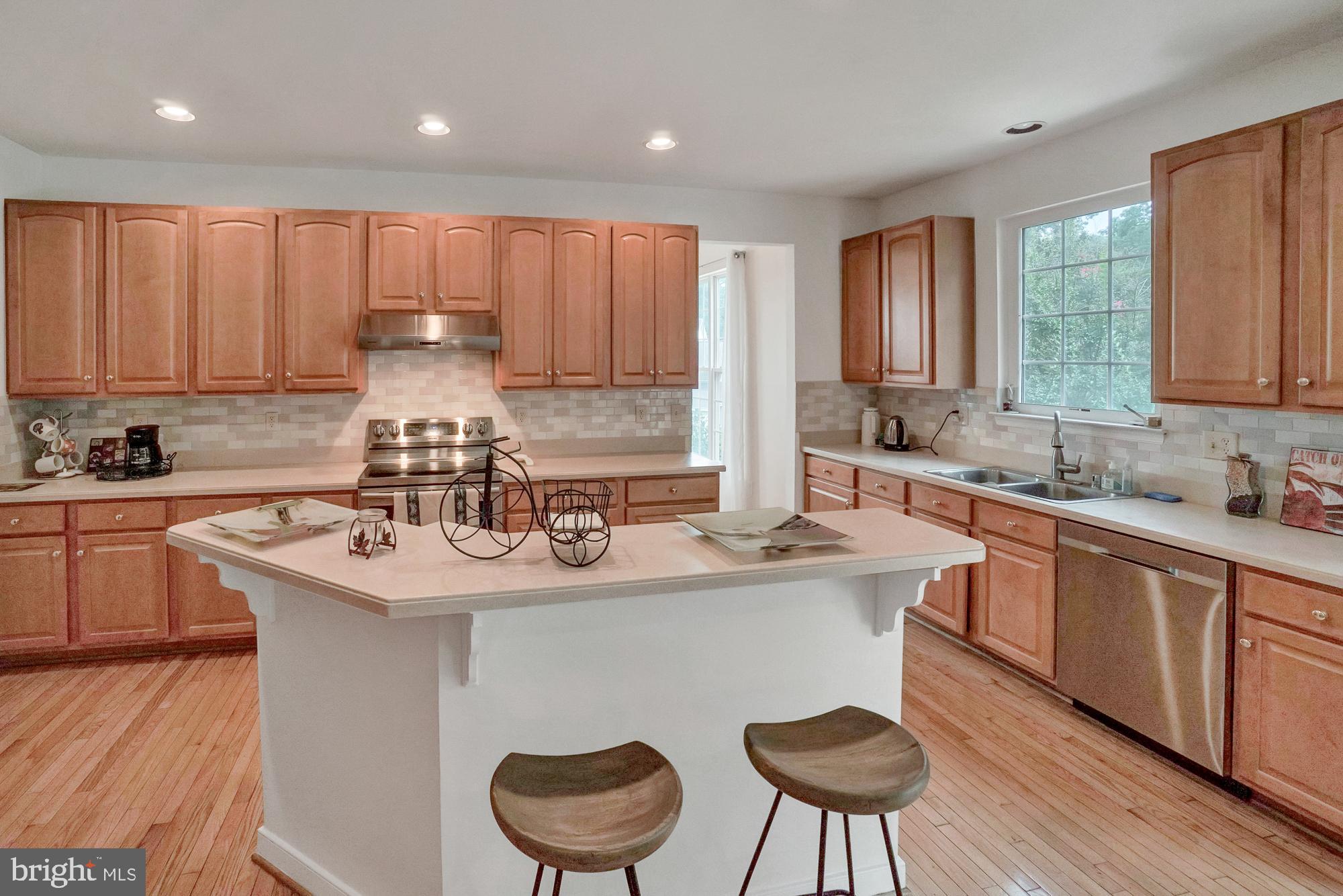 8059 High Castle Road Ellicott City, MD 21043 - Photo 16 of 45 Kitchen with new SS appliances & island
